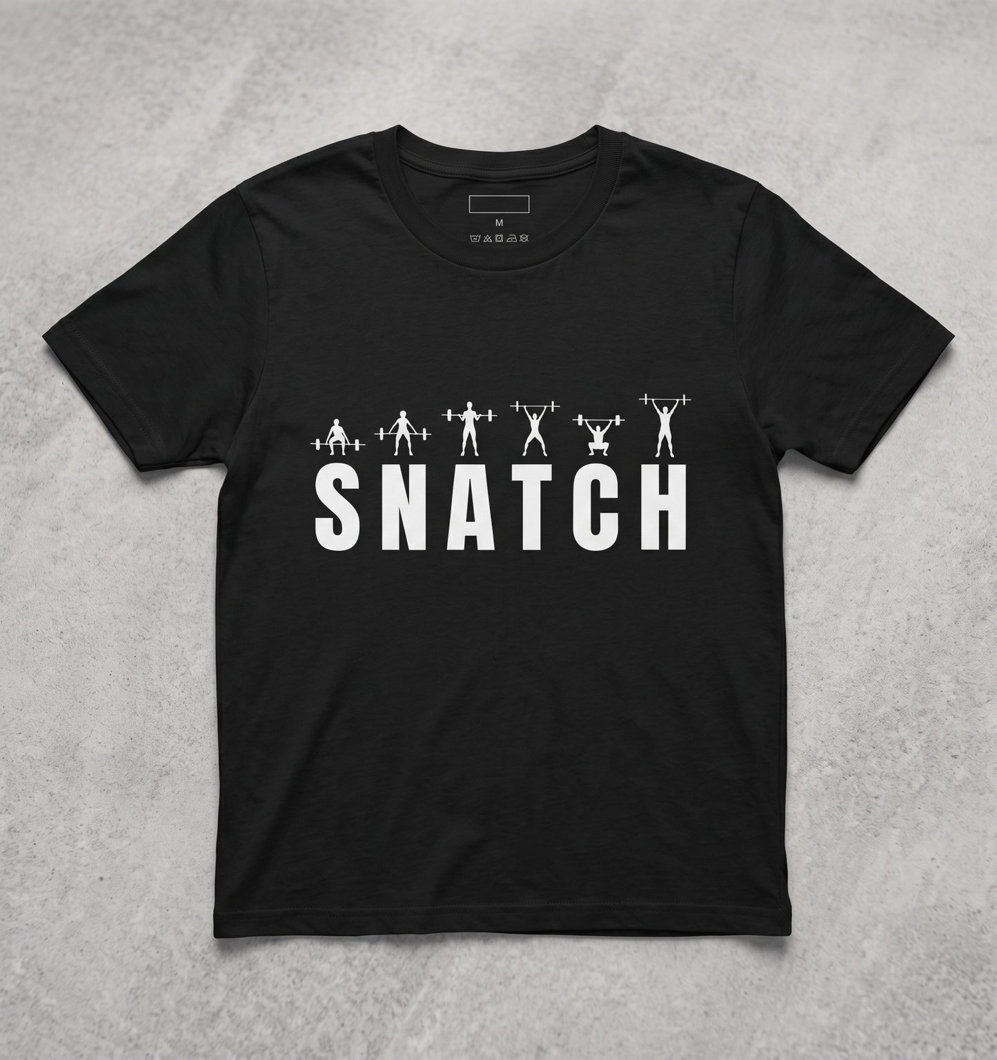 A black short-sleeve crewneck t-shirt with a white graphic print on the front. The graphic features the word 'SNATCH' in bold white letters, with stylized silhouettes of weightlifters and barbells above it.