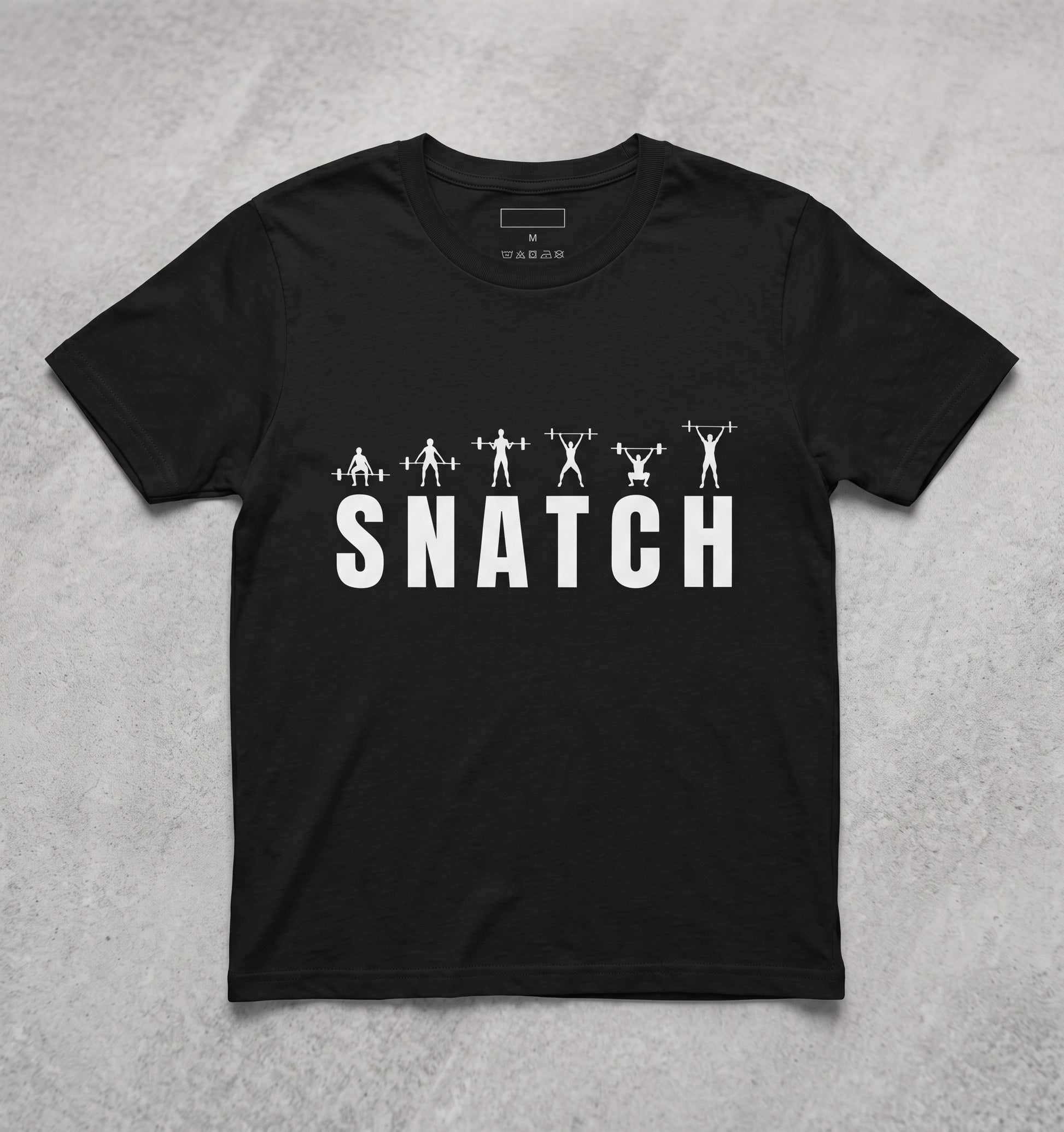 A black short-sleeve crewneck t-shirt with a white graphic print on the front. The graphic features the word 'SNATCH' in bold white letters, with stylized silhouettes of weightlifters and barbells above it.